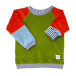 Genderneutraler Alltagsbegleiter für Kinder in Grün Orange Blau aus Bio-Baumwolle von der Marke Oktopulli