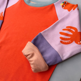 Faires Langarmshirt Kinder | Oktopus Orange Flieder